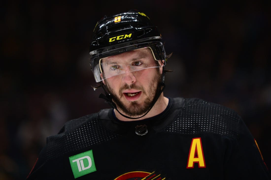 Feb 25, 2023; Vancouver, British Columbia, CAN; Vancouver Canucks forward J.T. Miller (9) awaits the start of play against the Boston Bruins during the second period at Rogers Arena. Mandatory Credit: Anne-Marie Sorvin-USA TODAY Sports