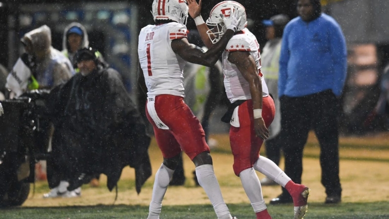 Feb 25, 2023; Las Vegas, NV, USA; D.C. Defenders quarterback D'Eriq King (3) celebrates with wide receiver Chris Blair (1) after scoring a touchdown against the Vegas Vipers in the fourth quarter at Cashman Field. Mandatory Credit: Candice Ward-USA TODAY Sports