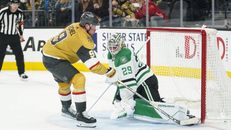 Feb 25, 2023; Las Vegas, Nevada, USA; Dallas Stars goaltender Jake Oettinger (29) makes a save against Vegas Golden Knights center Jack Eichel (9) during a shootout at T-Mobile Arena. Mandatory Credit: Lucas Peltier-USA TODAY Sports