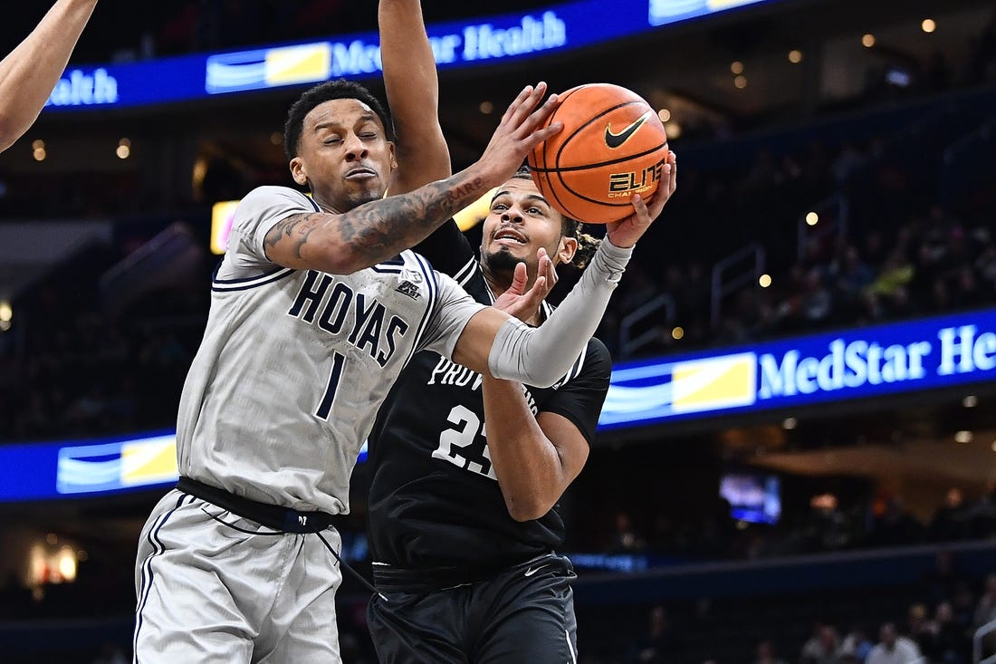 Feb 26, 2023; Washington, District of Columbia, USA; Georgetown Hoyas guard Primo Spears (1) is fouled by Providence Friars forward Bryce Hopkins (23) during the first half at Capital One Arena. Mandatory Credit: Brad Mills-USA TODAY Sports
