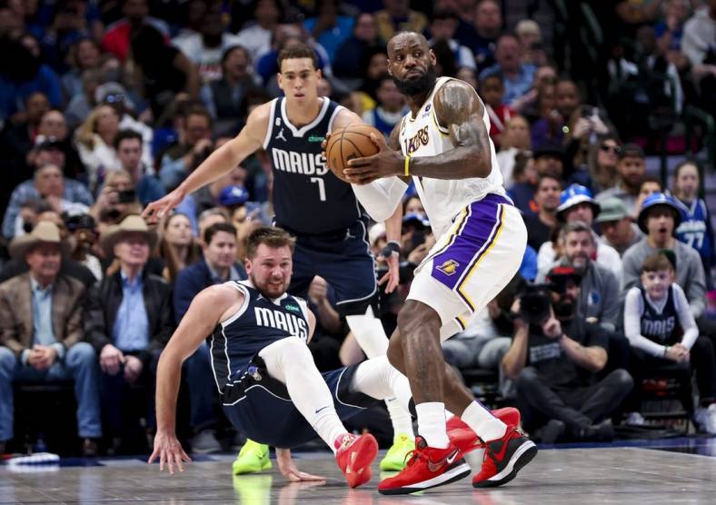 Feb 26, 2023; Dallas, Texas, USA;  Los Angeles Lakers forward LeBron James (6) looks to pass as Dallas Mavericks guard Luka Doncic (77) defends during the second quarter at American Airlines Center. Mandatory Credit: Kevin Jairaj-USA TODAY Sports