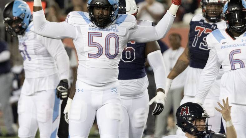 Feb 26, 2023; Houston, TX, USA;  Houston Roughnecks quarterback Brandon Silvers (12) looks for a horse collar call against Arlington  Renegades linebacker Willie Taylor (50) in the third quarter  at TDECU Stadium. Nom penalty was called on the play. Mandatory Credit: Thomas Shea-USA TODAY Sports