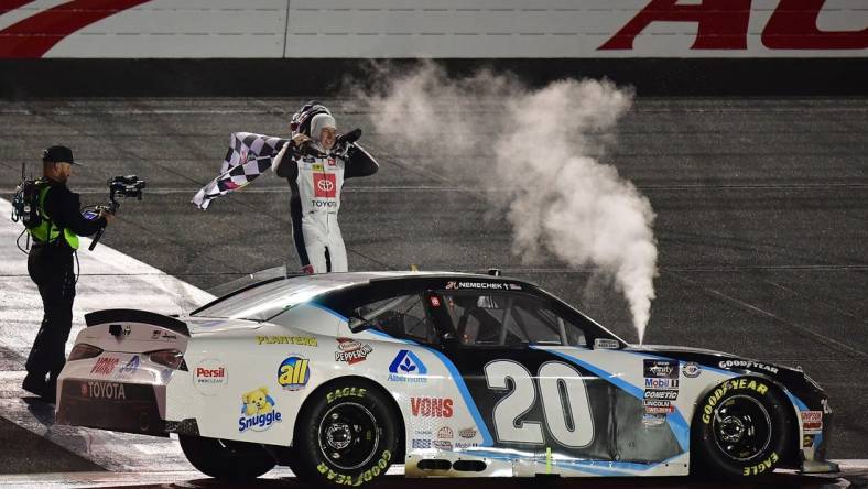 Feb 26, 2023; Fontana, California, USA; Xfinity Cup Series driver John Hunter Nemechek (20) celebrates his victory of  the Series Production Alliance Group 300 at Auto Club Speedway. Mandatory Credit: Gary A. Vasquez-USA TODAY Sports