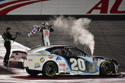 Feb 26, 2023; Fontana, California, USA; Xfinity Cup Series driver John Hunter Nemechek (20) celebrates his victory of  the Series Production Alliance Group 300 at Auto Club Speedway. Mandatory Credit: Gary A. Vasquez-USA TODAY Sports