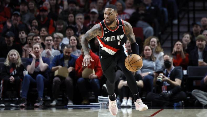 Feb 26, 2023; Portland, Oregon, USA; Portland Trail Blazers point guard Damian Lillard (0) dribbles the ball on a fast break during the first half against the Houston Rockets at Moda Center. Mandatory Credit: Soobum Im-USA TODAY Sports