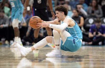 Feb 27, 2023; Charlotte, North Carolina, USA; Charlotte Hornets guard LaMelo Ball (1) controls the ball as he falls down during play during the second half against the Detroit Pistons at the Spectrum Center. Mandatory Credit: Sam Sharpe-USA TODAY Sports
