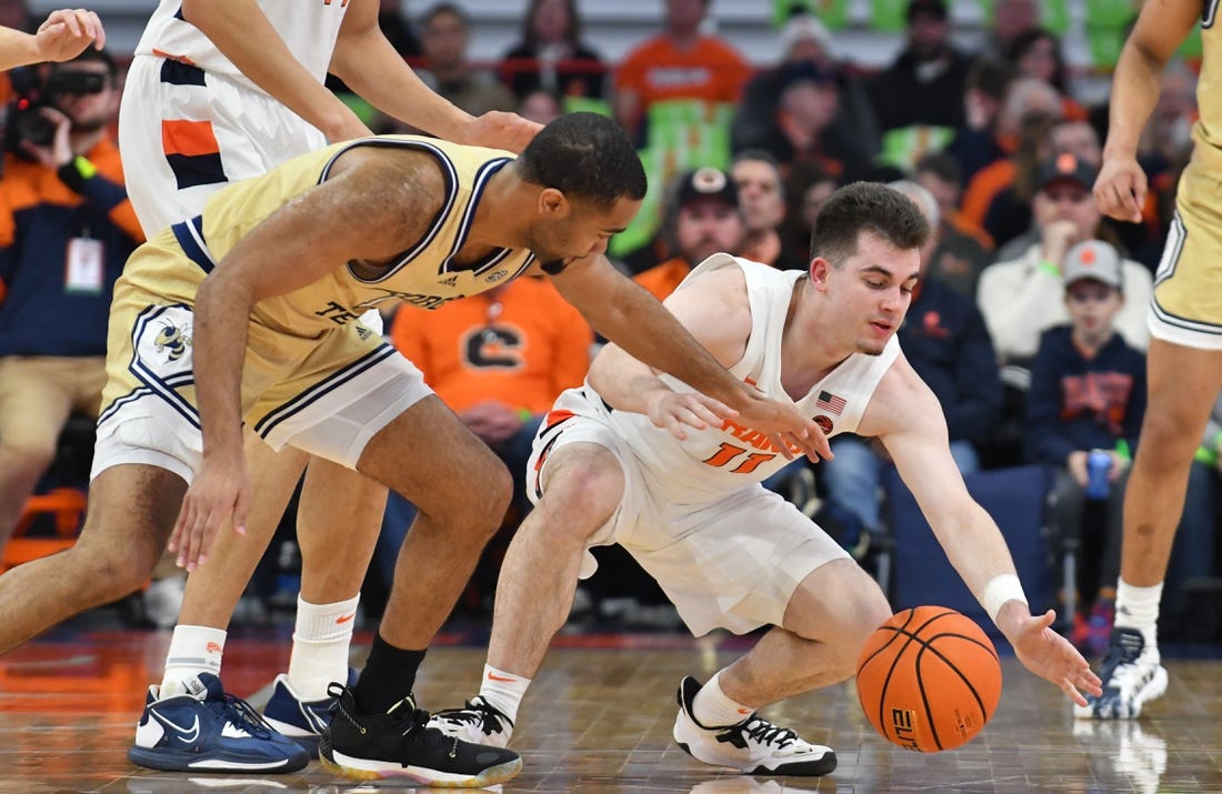 Feb 28, 2023; Syracuse, New York, USA; Syracuse Orange guard Joseph Girard III (11) and Georgia Tech Yellow Jackets guard Kyle Sturdivant (1) go for a loose ball in the first half at the JMA Wireless Dome. Mandatory Credit: Mark Konezny-USA TODAY Sports