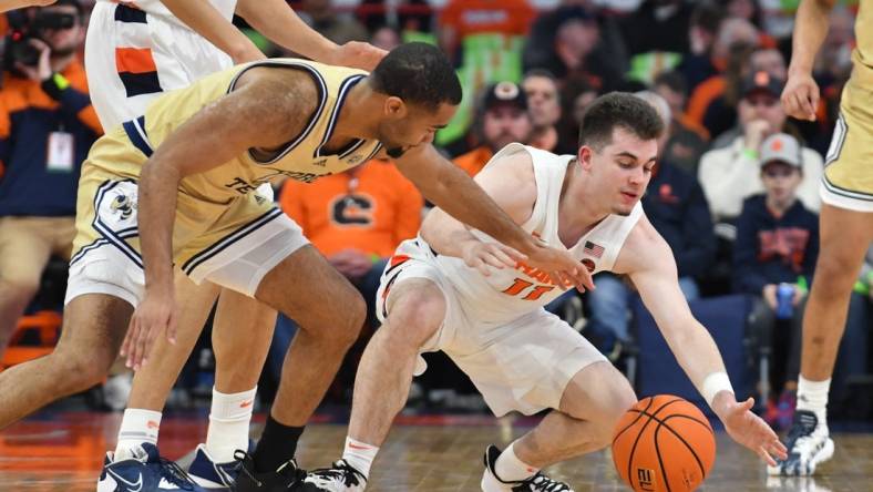 Feb 28, 2023; Syracuse, New York, USA; Syracuse Orange guard Joseph Girard III (11) and Georgia Tech Yellow Jackets guard Kyle Sturdivant (1) go for a loose ball in the first half at the JMA Wireless Dome. Mandatory Credit: Mark Konezny-USA TODAY Sports