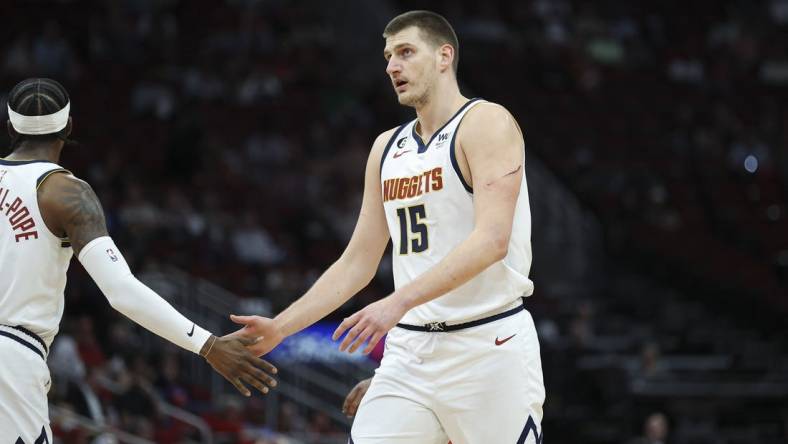 Feb 28, 2023; Houston, Texas, USA; Denver Nuggets center Nikola Jokic (15) reacts after a play during the first quarter against the Houston Rockets at Toyota Center. Mandatory Credit: Troy Taormina-USA TODAY Sports