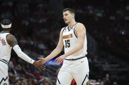 Feb 28, 2023; Houston, Texas, USA; Denver Nuggets center Nikola Jokic (15) reacts after a play during the first quarter against the Houston Rockets at Toyota Center. Mandatory Credit: Troy Taormina-USA TODAY Sports