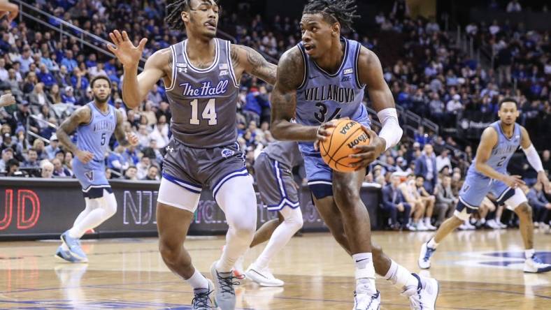 Feb 28, 2023; Newark, New Jersey, USA;  Villanova Wildcats forward Brandon Slater (34) looks to drive past Seton Hall Pirates guard Dre Davis (14) in the first half at Prudential Center. Mandatory Credit: Wendell Cruz-USA TODAY Sports