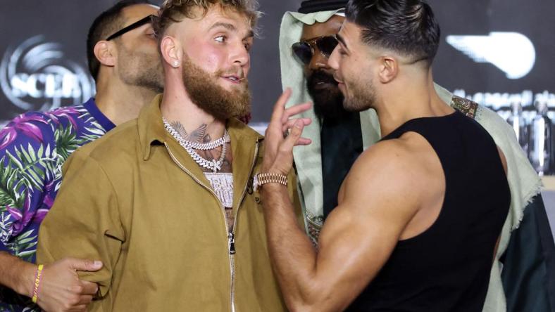 Jake Paul and Tommy Fury clash as Derek Chisora and Jake Paul's manager Nakisa Bidarian intervene during the press conference in Riyadh, Saudi Arabia on Feb. 23, 2023.