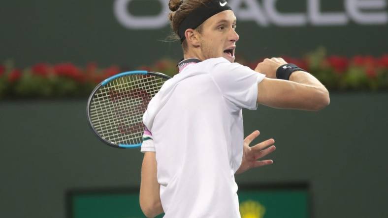 Nicolas Jarry returns a shot to Frances Tiafoe at the BNP Paribas Open, Indian Wells, Calif., March 8, 2019.

Tiafoe 7