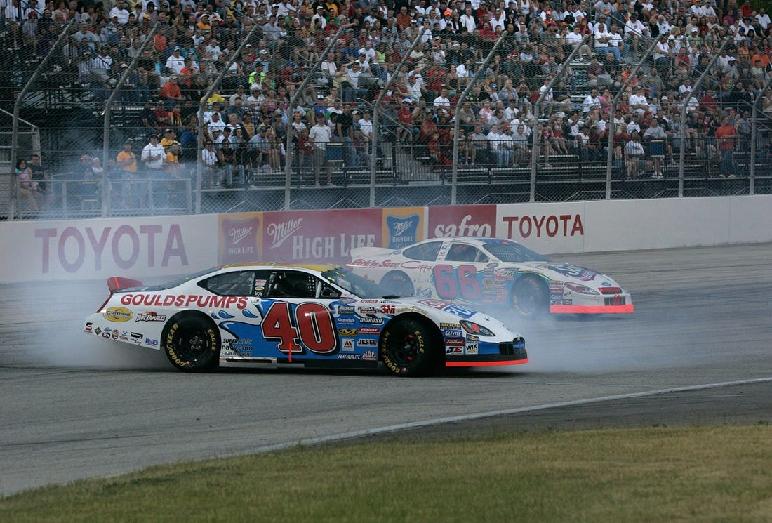 Car number 40 driven by Scott Lagasse Jr. goes sideways on turn 4 on lap 22 after car number 66 driven by Aaron Fike lost control on turn 4 during the Nascar Busch series SBC 250 at the Milwaukee Mile in West Allis Saturday, June 25, 2005. (Photo by David Joles)

Race26 Race26sptjoles2 Of Sev