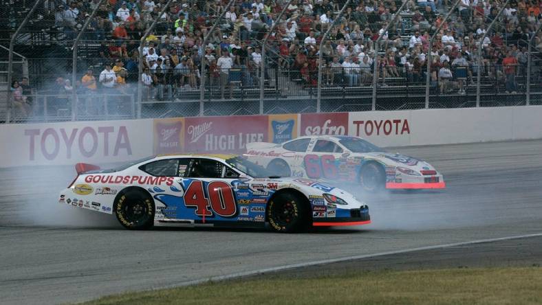 Car number 40 driven by Scott Lagasse Jr. goes sideways on turn 4 on lap 22 after car number 66 driven by Aaron Fike lost control on turn 4 during the Nascar Busch series SBC 250 at the Milwaukee Mile in West Allis Saturday, June 25, 2005. (Photo by David Joles)

Race26 Race26sptjoles2 Of Sev