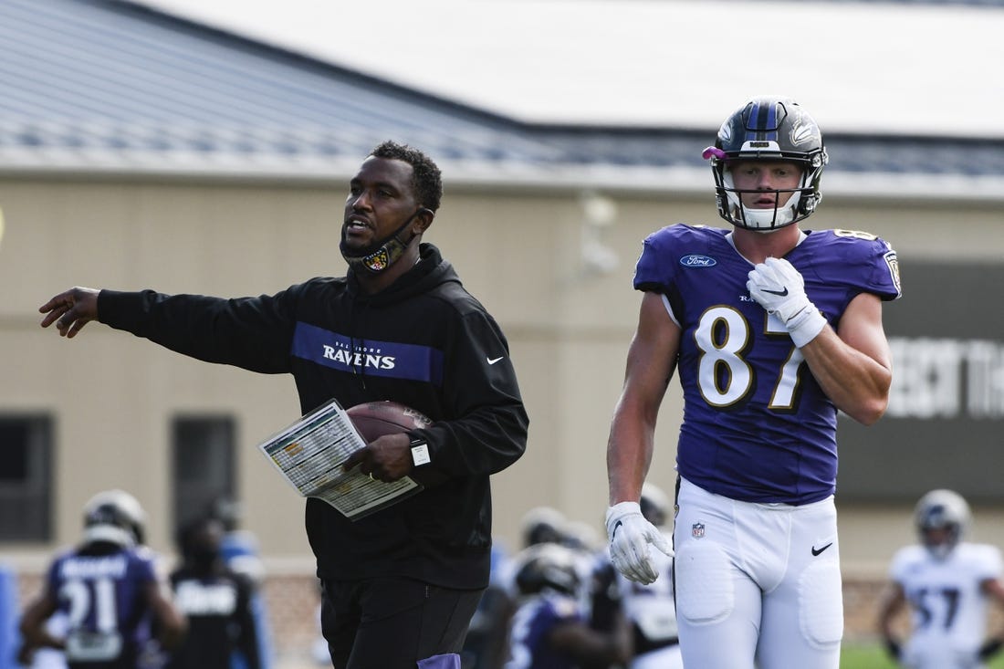 Aug 17, 2020; Owings Mills, Maryland, USA;  Baltimore Ravens tight end coach Bobby Engram  provides direction as tight end Eli Wolf (87) walks across the field at Under Armour Performance Center. Mandatory Credit: Tommy Gilligan-USA TODAY Sports