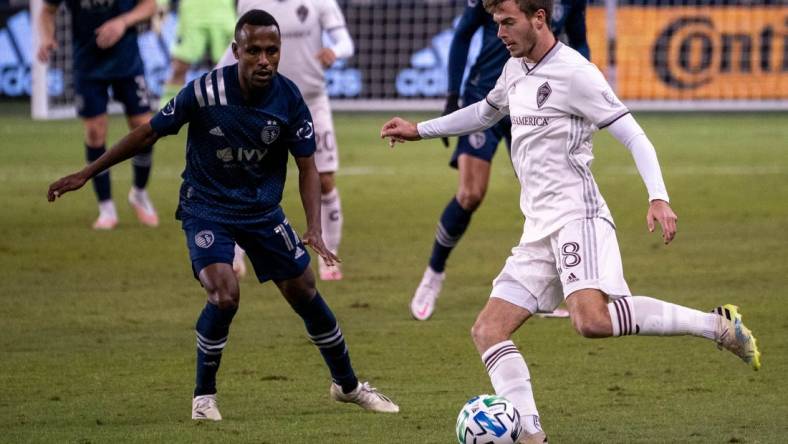 Oct 24, 2020; Kansas City, Kansas, USA; Colorado Rapids defender Jeremy Kelly (18) moves the ball as Sporting Kansas City midfielder Gadi Kinda (17) defends during the match at Children's Mercy Park. Mandatory Credit: Denny Medley-USA TODAY Sports