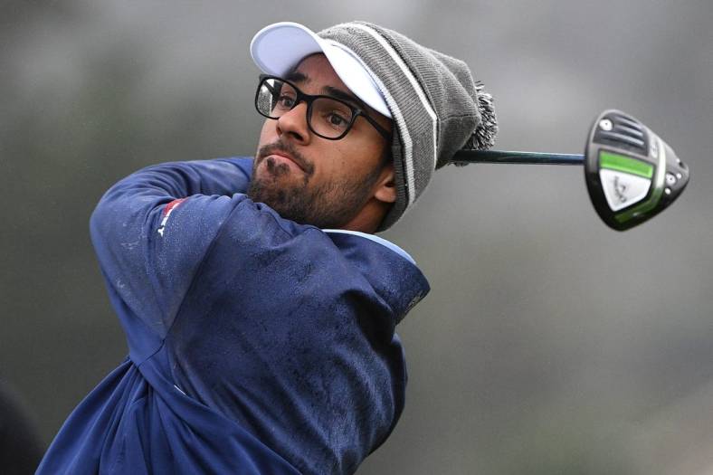 Feb 13, 2021; Pebble Beach, California, USA; Akshay Bhatia plays his shot from the first tee during the third round of the AT&T Pebble Beach Pro-Am golf tournament at Pebble Beach Golf Links. Mandatory Credit: Orlando Ramirez-USA TODAY Sports