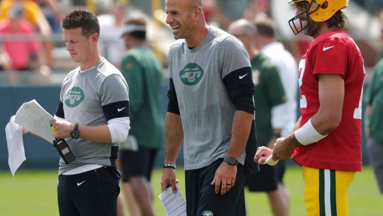 New York Jets offensive coordinator Mike LaFleur, left, head coach Robert Saleh and Green Bay Packers quarterback Aaron Rodgers (12) participate in training camp Wednesday.

Ar Saleh Mike