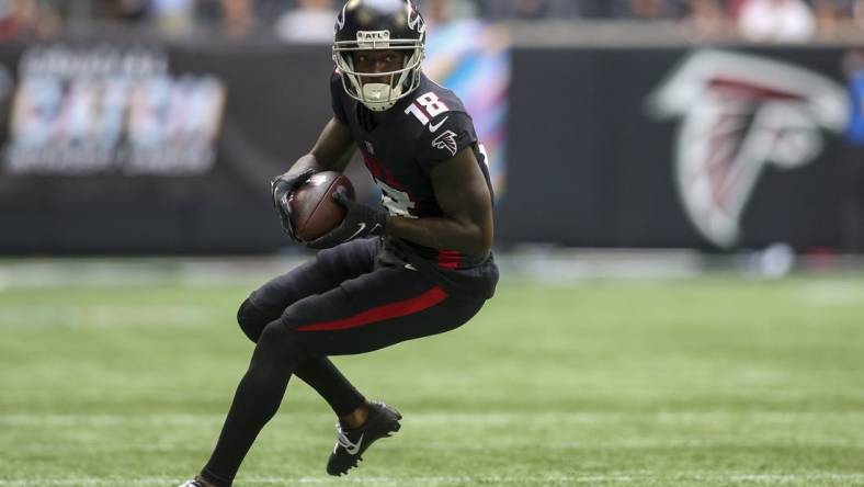 Oct 3, 2021; Atlanta, Georgia, USA; Atlanta Falcons wide receiver Calvin Ridley (18) runs after a catch against the Washington Football Team in the second quarter at Mercedes-Benz Stadium. Mandatory Credit: Brett Davis-USA TODAY Sports