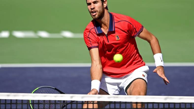 Oct 12, 2021; Indian Wells, CA, USA; Karen Khachanov (RUS) hits a shot against Pablo Carreno Busta (ESP) during a fourth round match in the BNP Paribas Open at the Indian Wells Tennis Garden. Mandatory Credit: Jayne Kamin-Oncea-USA TODAY Sports