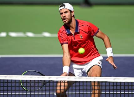 Oct 12, 2021; Indian Wells, CA, USA; Karen Khachanov (RUS) hits a shot against Pablo Carreno Busta (ESP) during a fourth round match in the BNP Paribas Open at the Indian Wells Tennis Garden. Mandatory Credit: Jayne Kamin-Oncea-USA TODAY Sports