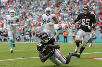 Oct 24, 2021; Miami Gardens, Florida, USA; Atlanta Falcons wide receiver Calvin Ridley (18) makes a catch in the end zone for a touchdown against the Miami Dolphins during the second quarter of the game at Hard Rock Stadium. Mandatory Credit: Sam Navarro-USA TODAY Sports