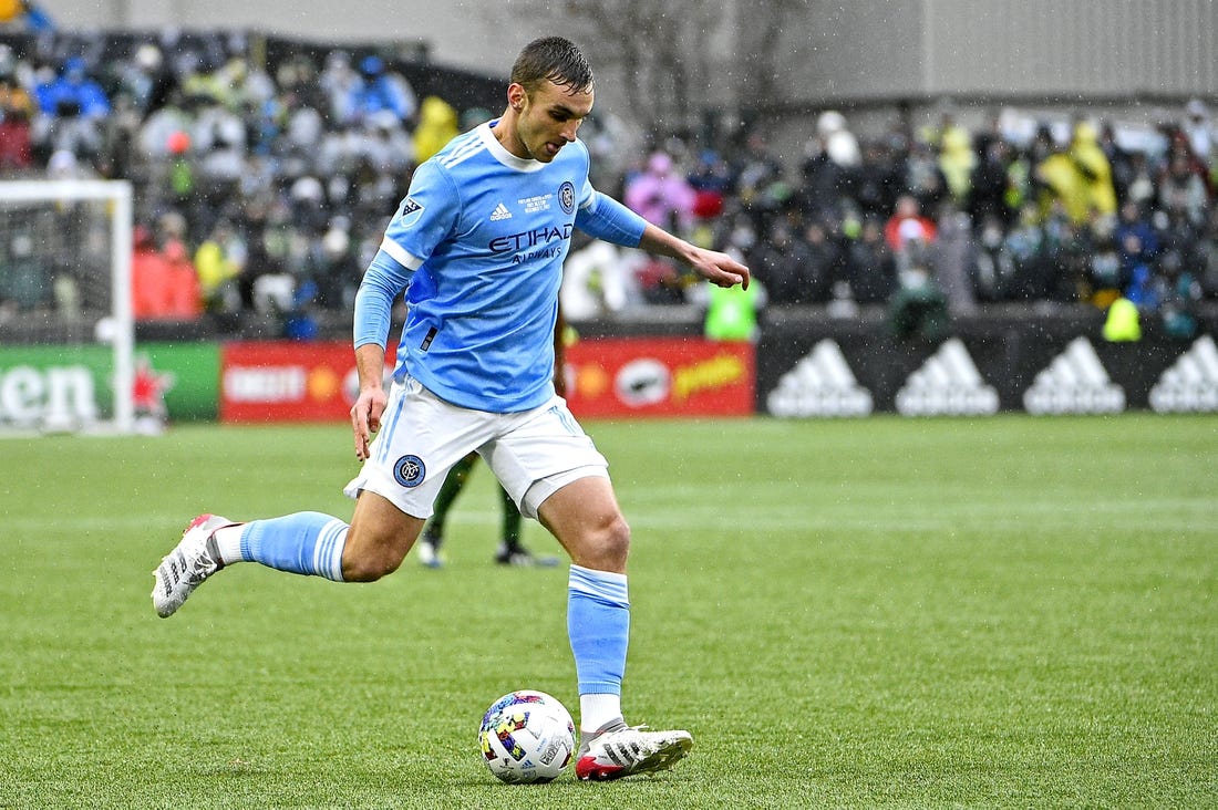 Dec 11, 2021; Portland, OR, USA; New York City FC midfielder James Sands (16) kicks the ball during the first half against the Portland Timbers in the 2021 MLS Cup championship game at Providence Park. Mandatory Credit: Troy Wayrynen-USA TODAY Sports