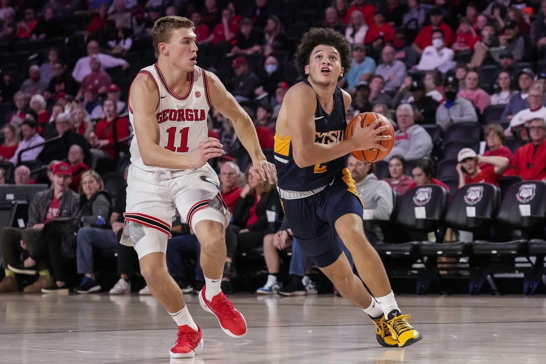 Dec 22, 2021; Athens, Georgia, USA; East Tennessee State Buccaneers guard Jordan King (2) drives to the basket against Georgia Bulldogs forward Jaxon Etter (11) during the first half at Stegeman Coliseum. Mandatory Credit: Dale Zanine-USA TODAY Sports