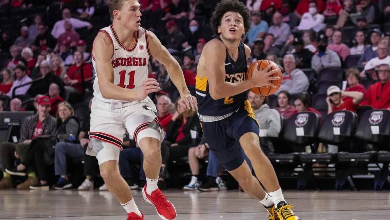 Dec 22, 2021; Athens, Georgia, USA; East Tennessee State Buccaneers guard Jordan King (2) drives to the basket against Georgia Bulldogs forward Jaxon Etter (11) during the first half at Stegeman Coliseum. Mandatory Credit: Dale Zanine-USA TODAY Sports