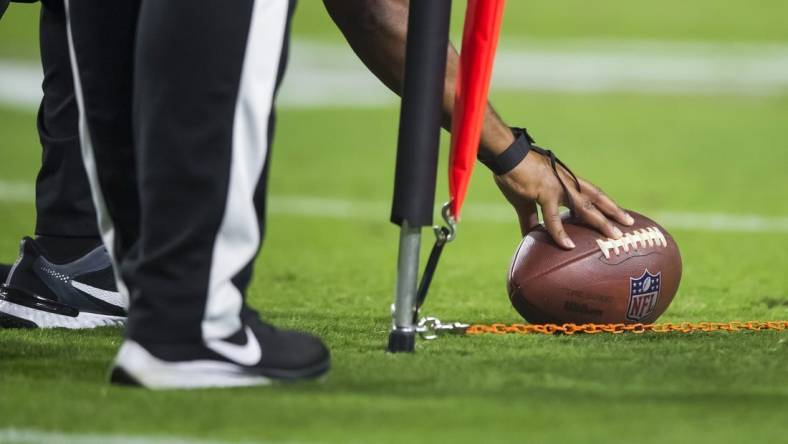 Oct 28, 2021; Glendale, Arizona, USA; Detailed view as referee measures the football for a first down with yard markers during the Arizona Cardinals game against the Green Bay Packers at State Farm Stadium. Mandatory Credit: Mark J. Rebilas-USA TODAY Sports