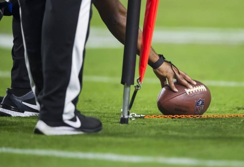 Oct 28, 2021; Glendale, Arizona, USA; Detailed view as referee measures the football for a first down with yard markers during the Arizona Cardinals game against the Green Bay Packers at State Farm Stadium. Mandatory Credit: Mark J. Rebilas-USA TODAY Sports