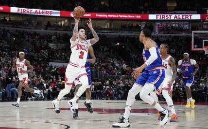 Jan 14, 2022; Chicago, Illinois, USA; Chicago Bulls guard Lonzo Ball (2) looks to pass the ball against the Golden State Warriors during the first half at United Center. Mandatory Credit: David Banks-USA TODAY Sports