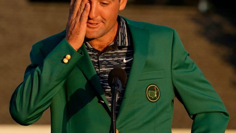 Scottie Scheffler reacts at the podium while wearing the green jacket during the final round of the Masters.

Usp Golf Masters Tournament Final Round S Glf Usa Ga