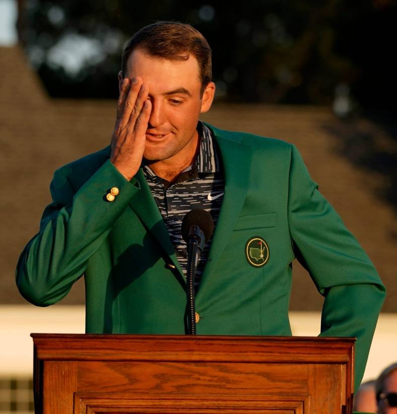 Scottie Scheffler reacts at the podium while wearing the green jacket during the final round of the Masters.

Usp Golf Masters Tournament Final Round S Glf Usa Ga