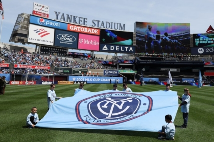 May 1, 2022; New York, New York, USA; Young fans hold a New York City FC banner on the pitch before the game against the San Jose Earthquakes at Yankee Stadium. Mandatory Credit: Vincent Carchietta-USA TODAY Sports