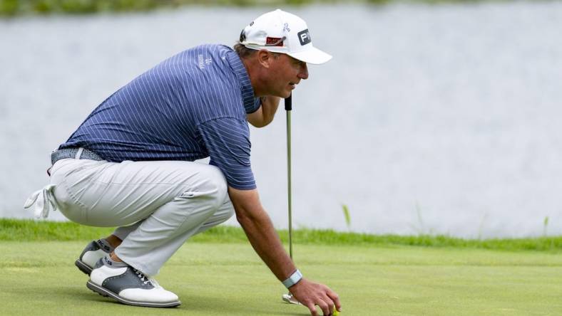 May 26, 2022; Benton Harbor, Michigan, USA; Chris Dimarco reads his putt on the eighteenth green during the first round of the 2022 KitchenAid Senior PGA Championship at Harbor Shores. Mandatory Credit: Raj Mehta-USA TODAY Sports