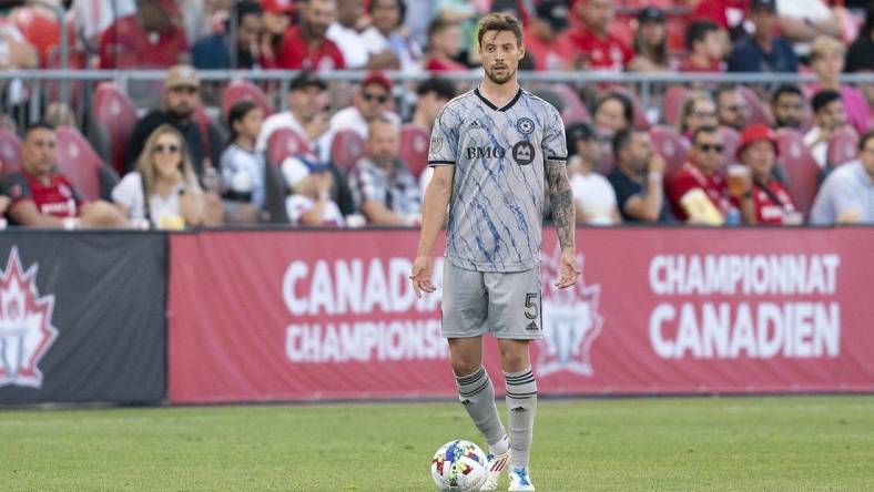 Jun 22, 2022; Toronto, Ontario, CAN; CF Montreal defender Gabriele Corbo (5) controls the ball against Toronto FC during the second half of the Canadian Championship semifinal at BMO Field. Mandatory Credit: Nick Turchiaro-USA TODAY Sports