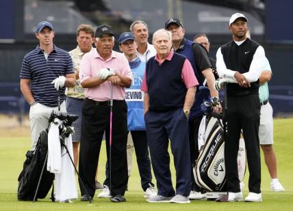 Jul 11, 2022; St. Andrews, SCT; Rory McIlroy, Lee Trevino, Jack Nicklaus, and Tiger Woods during the R&A Celebration of Champions four-hole challenge at the 150th Open Championship golf tournament at St. Andrews Old Course. Mandatory Credit: Rob Schumacher-USA TODAY Sports