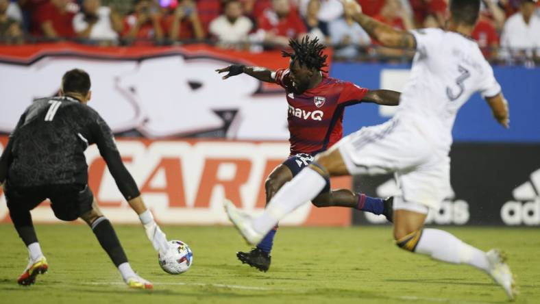 Jul 30, 2022; Frisco, Texas, USA; FC Dallas midfielder Ema Twumasi (22) shoots the ball against Los Angeles Galaxy goalkeeper Jonathan Bond (1) in the second half at Toyota Stadium. Mandatory Credit: Tim Heitman-USA TODAY Sports