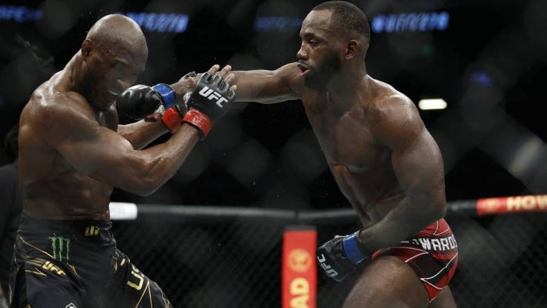 Aug 20, 2022; Salt Lake City, Utah, USA; Kamaru Usman (red gloves) fights Leon Edwards (blue gloves) during UFC 278 at Vivint Arena. Mandatory Credit: Jeffrey Swinger-USA TODAY Sports