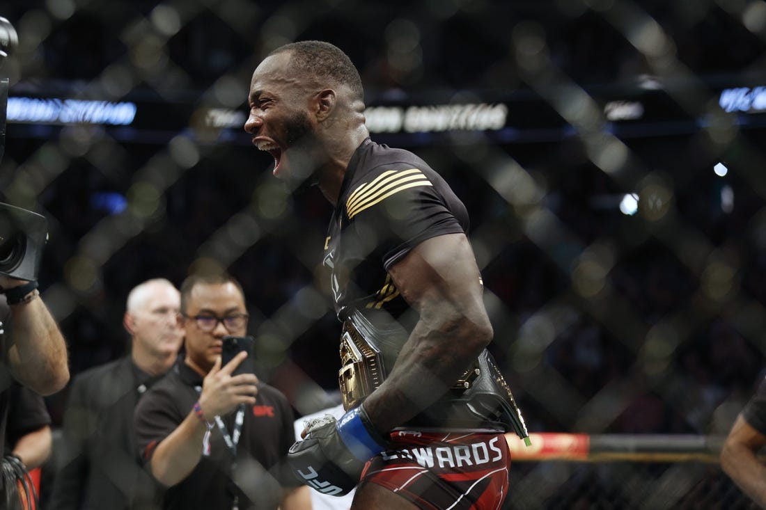 Aug 20, 2022; Salt Lake City, Utah, USA; Leon Edwards (blue gloves) reacts after defeating Kamaru Usman (red gloves) during UFC 278 at Vivint Arena. Mandatory Credit: Jeffrey Swinger-USA TODAY Sports