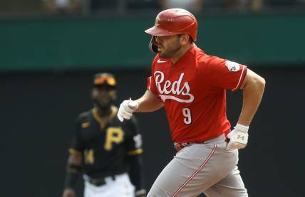 Aug 21, 2022; Pittsburgh, Pennsylvania, USA; Cincinnati Reds first baseman Mike Moustakas (9) rounds the bases after hitting a two run home run against the Pittsburgh Pirates during the third inning at PNC Park. Mandatory Credit: Charles LeClaire-USA TODAY Sports