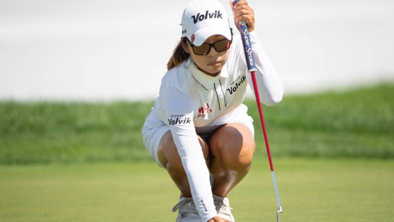 Aug 28, 2022; Ottawa, Ontario, CAN; Mi Hyang Lee from Korea sets up the ball on the 18th hole green during the final round of the CP Women's Open golf tournament. Mandatory Credit: Marc DesRosiers-USA TODAY Sports