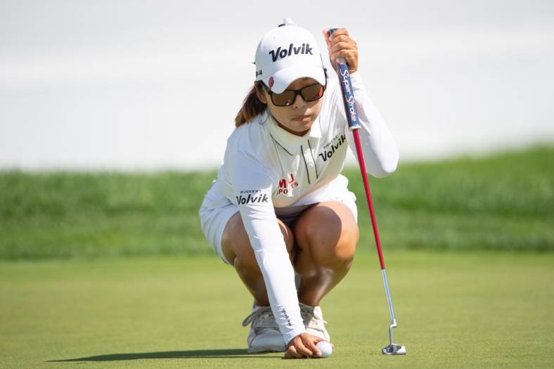 Aug 28, 2022; Ottawa, Ontario, CAN; Mi Hyang Lee from Korea sets up the ball on the 18th hole green during the final round of the CP Women's Open golf tournament. Mandatory Credit: Marc DesRosiers-USA TODAY Sports