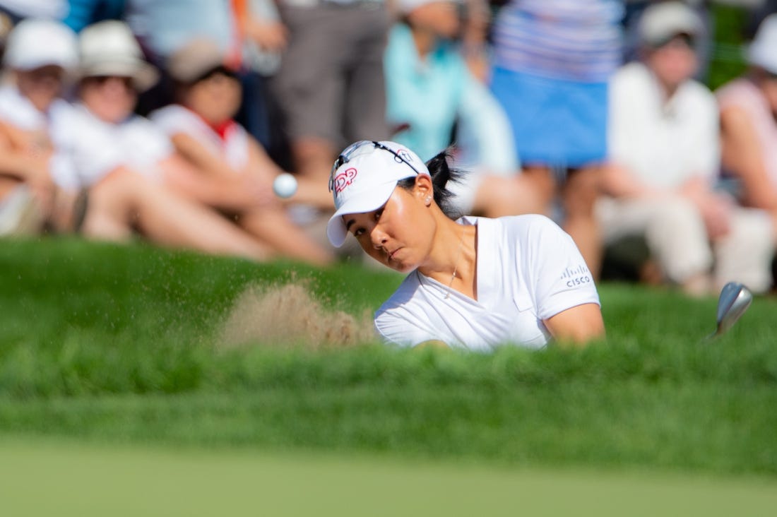 Aug 28, 2022; Ottawa, Ontario, CAN; Danielle Kang from the United States plays from the bunker on the 18th hole in the final round of the CP Women's Open golf tournament. Mandatory Credit: Marc DesRosiers-USA TODAY Sports