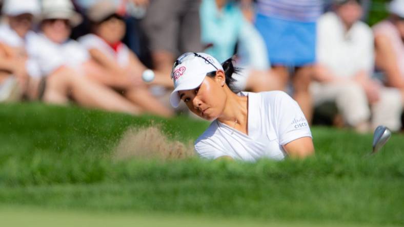 Aug 28, 2022; Ottawa, Ontario, CAN; Danielle Kang from the United States plays from the bunker on the 18th hole in the final round of the CP Women's Open golf tournament. Mandatory Credit: Marc DesRosiers-USA TODAY Sports