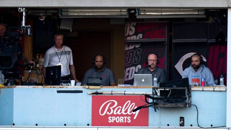 Cincinnati Reds first baseman Joey Votto participates in the live television broadcast of the Cincinnati Reds with Barry Larkin, center, and John Sadak, left, in the third inning of the MLB game between between the Cincinnati Reds and the St. Louis Cardinals at Great American Ball Park in Cincinnati, Wednesday, Aug. 31, 2022.

St Louis Cardinals At Cincinnati Reds