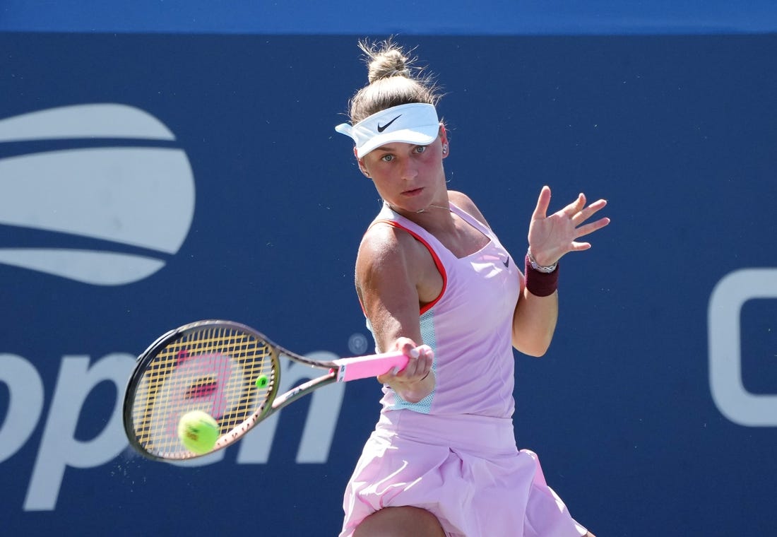 Sep 1, 2022; Flushing, NY, USA; Marta Kostyuk of Ukraine hits a shot against Victoria Azarenka on day four of the 2022 U.S. Open tennis tournament at USTA Billie Jean King Tennis Center. Mandatory Credit: Jerry Lai-USA TODAY Sports