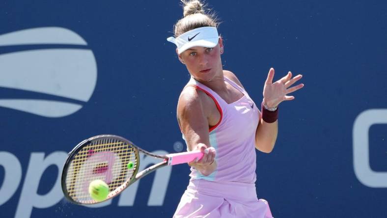 Sep 1, 2022; Flushing, NY, USA; Marta Kostyuk of Ukraine hits a shot against Victoria Azarenka on day four of the 2022 U.S. Open tennis tournament at USTA Billie Jean King Tennis Center. Mandatory Credit: Jerry Lai-USA TODAY Sports